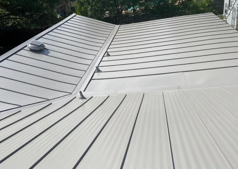 Solar attic fan installed on a metal roof for Roof Ventilation in Moyock
